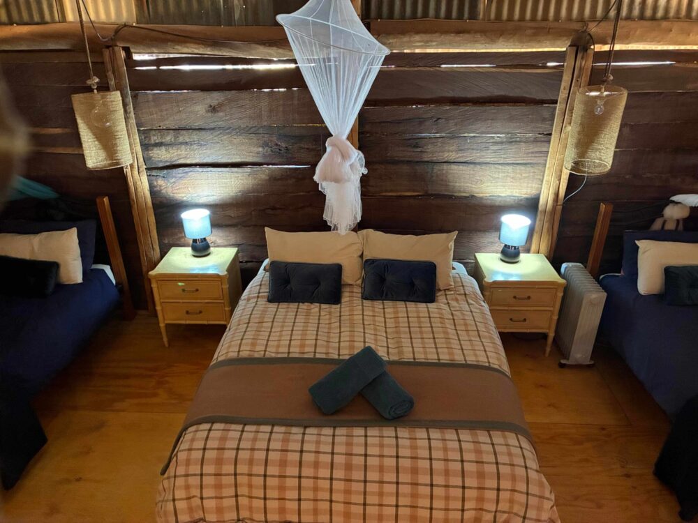 Bush Cottage queen bed and interior at Ooraminna Homestead